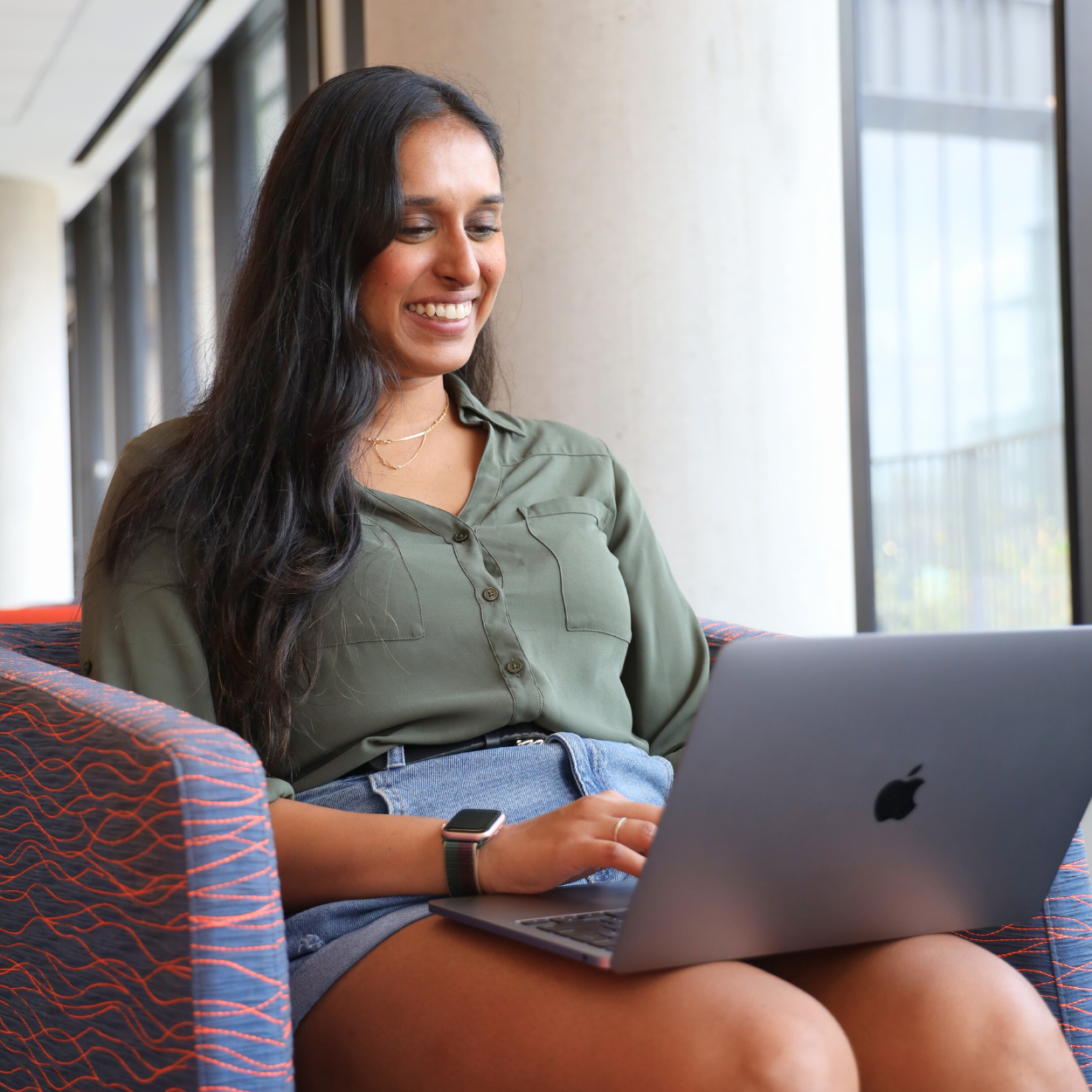 Student typing on a laptop